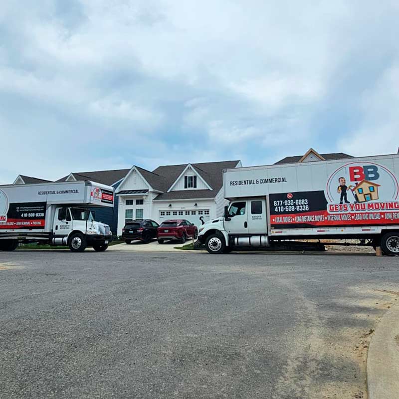 Movers unloading household furniture after an interstate relocation